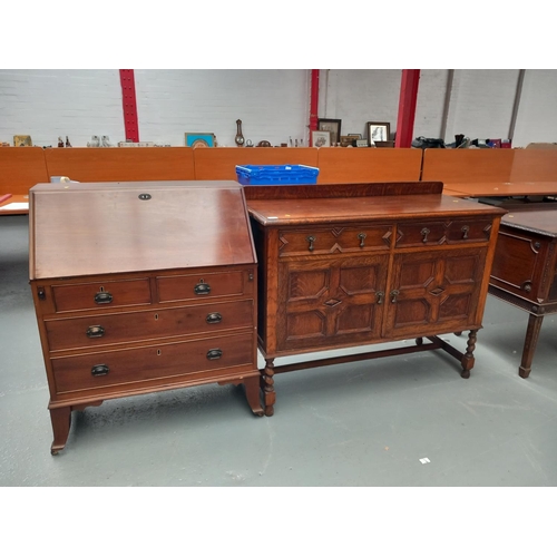 105 - A mahogany bureau together with an oak sideboard