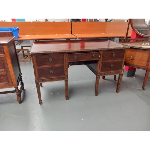 106 - An mahogany twin pedestal desk together with a semi circular dressing table