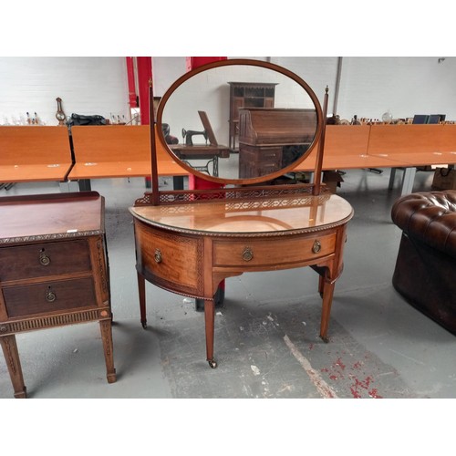 106 - An mahogany twin pedestal desk together with a semi circular dressing table