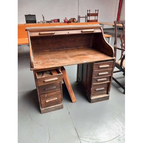 110 - An oak roll top desk