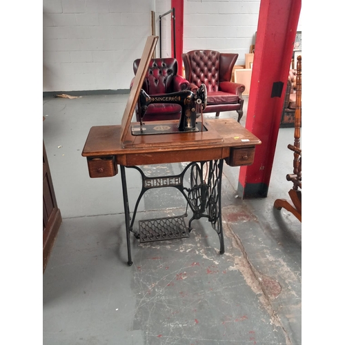 117 - A singer sewing machine with treadle