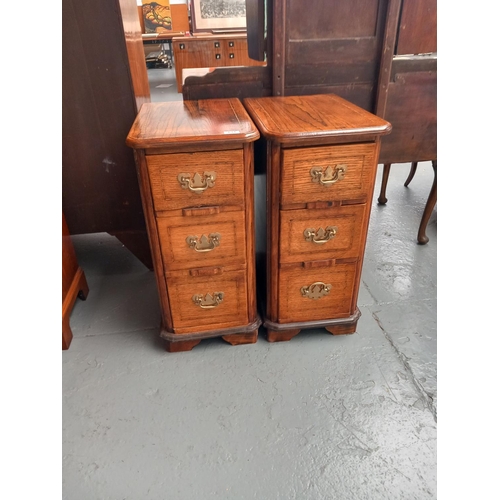 131 - A pair of oak inlaid bedside cabinets