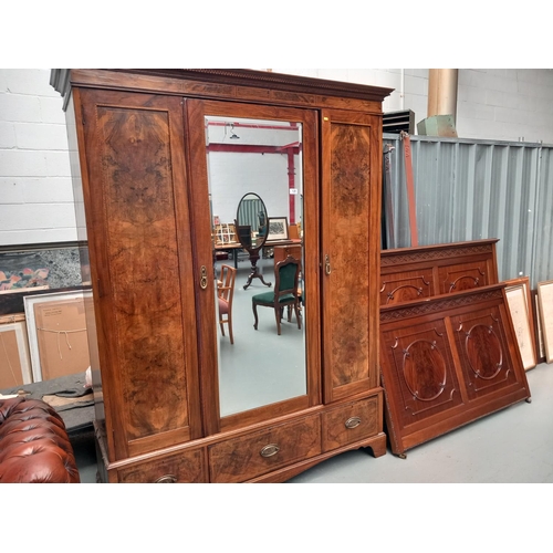 139 - A mahogany mirrored door double wardrobe together with a double mahogany bed