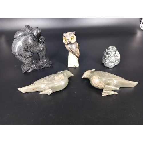 201 - Two inuit stone carvings and three other carved stone figures (damage to one bird)