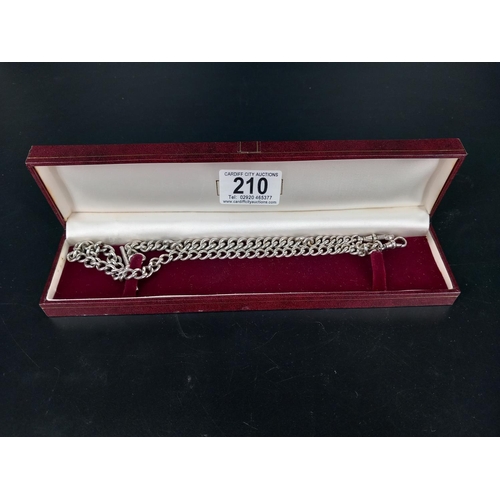 210 - A hallmarked silver watch/albert chain and a shorter silver watch chain (combined weight 72 grams)