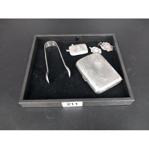 211 - A hallmarked silver cigarette case, vesta, sugar tongs and two watch fobs (total silver weight 161 g... 