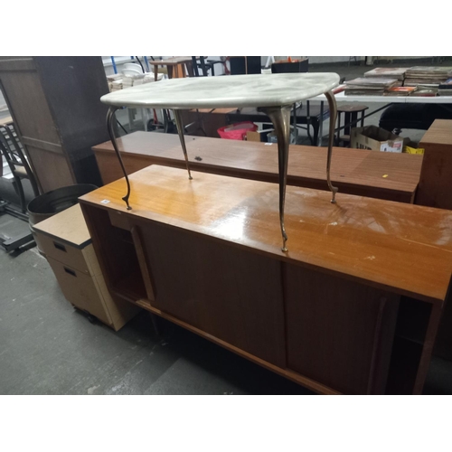 560 - A teak sideboard, marble/onyx top coffee table, filing cabinet etc