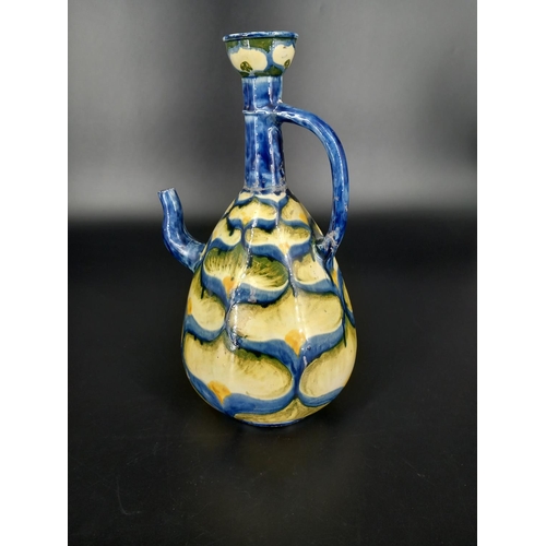 201 - A Della Robbia wine Ewer by Cassandra Annie Walker 11.5 inches tall (crack to the spout) repair to t... 