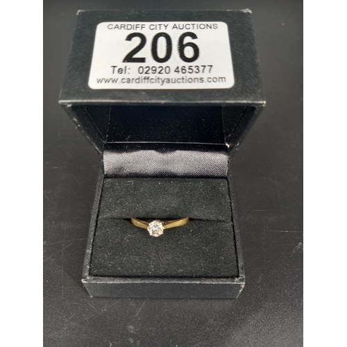 206 - An 18k gold and solitaire diamond engagement ring (0.2k diamond)