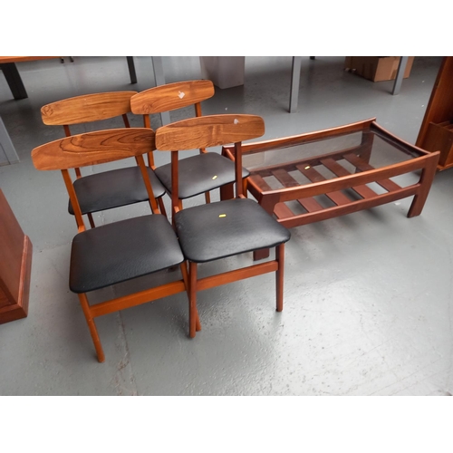 104 - Four dining chairs and a teak glass top coffee table