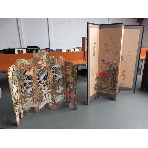 109 - A wooden carved marine scene five panel folding screen together with a black laquered folding screen... 