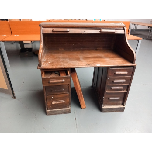 110 - An oak roll top desk