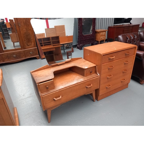 118 - An oak E Gomme G Plan chest of drawers and matching table