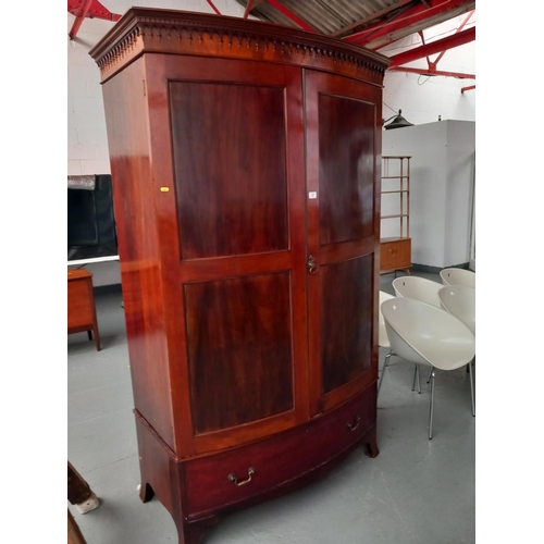 121 - A mahogany bow fronted double wardrobe