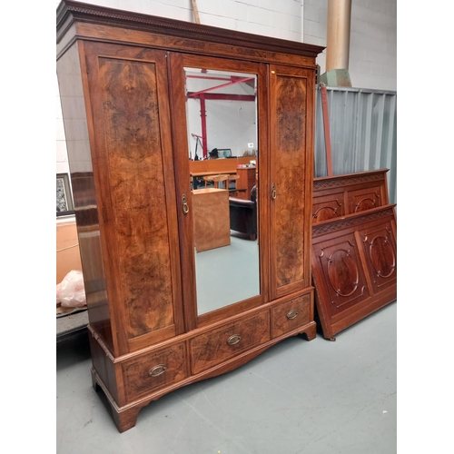 124 - A mahogany mirrored door double wardrobe together with a double mahogany bed