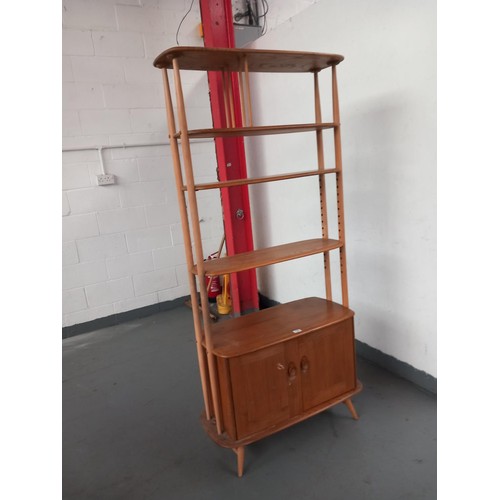 130 - An ercol giraffe bookcase