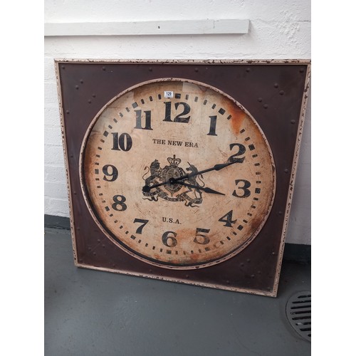 129 - A large metal case wall hanging clock