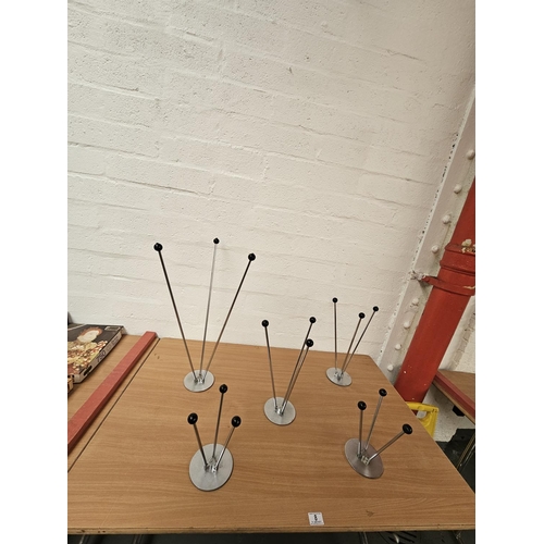 8 - Five mid-century shop display hat stands