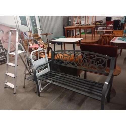 628 - A metal garden bench and three aluminium step ladders