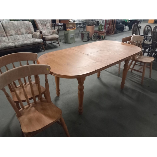 633 - Pine extending dining table and four chairs