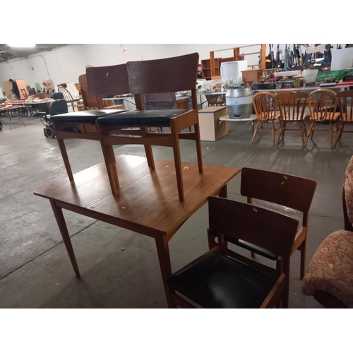 638 - A teak extending dining table with four chairs