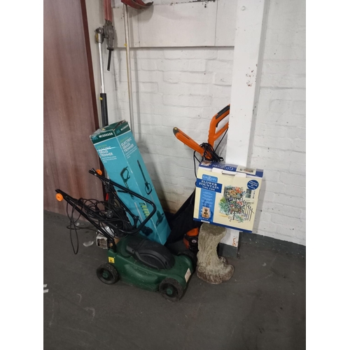 641 - An electric lawnmower, strimmer, petrol hedge trimmer