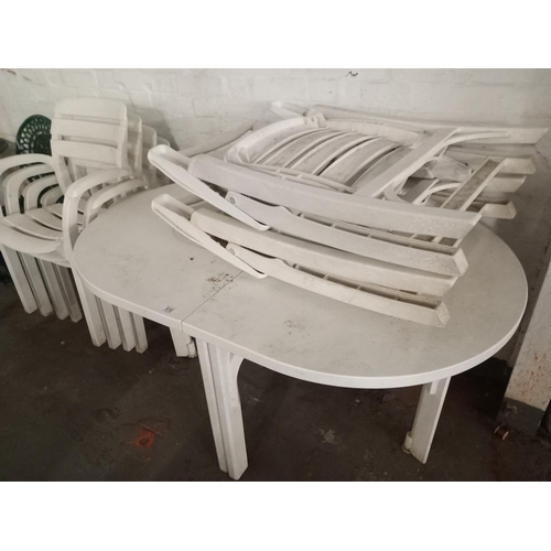 650 - Plastic garden table and four stacking chairs and two folding chairs