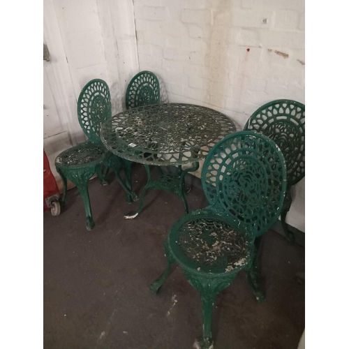 651 - Metal garden table and four chairs