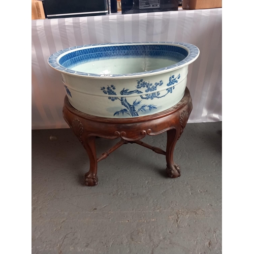 101 - A chinese 18th/19th century large blue and white washbowl on wooden stand 26 inches in diameter and ... 