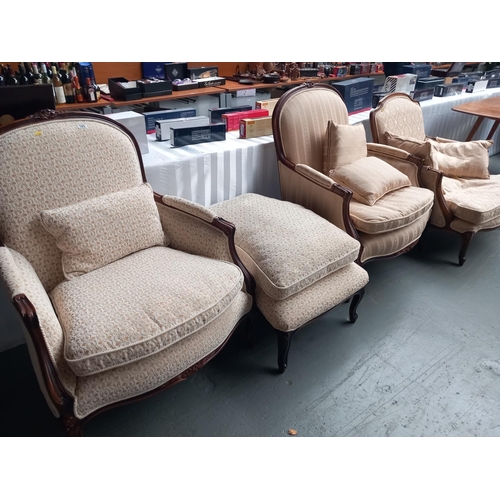 103 - Three reproduction french style upholstered armchairs one with matching footstool