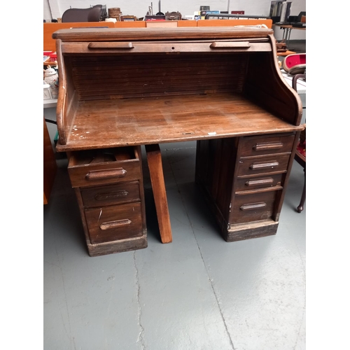 111 - An oak roll top desk