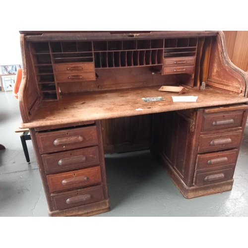 118 - A twin pedestal oak roll top desk