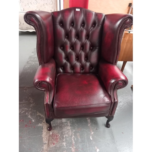 119 - Red leather Chesterfield Wingback armchair