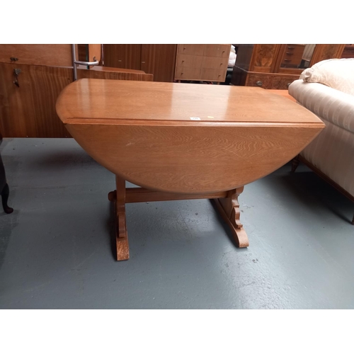 120 - An ercol drop leaf dining table