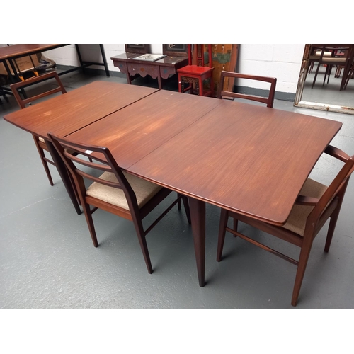 140 - A Richard Hornby extending dining table and four chairs