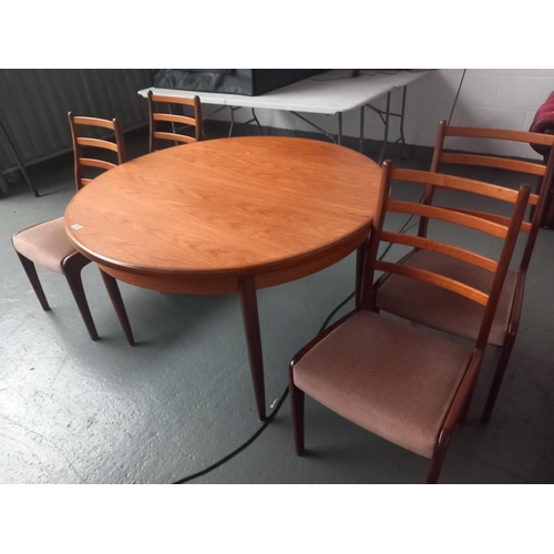 151 - Circular teak G Plan dining table and four chairs