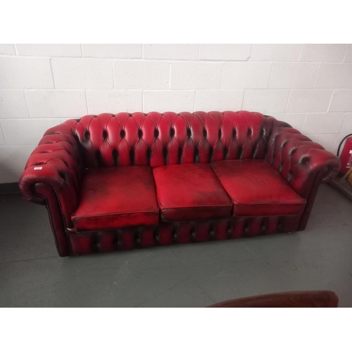 153 - Red leather chesterfield three seater sofa