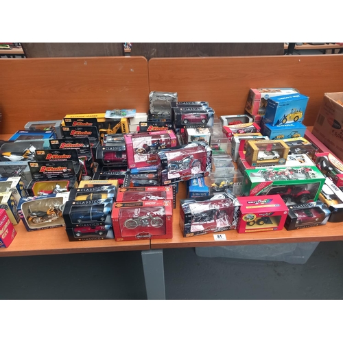 81 - A collection of boxed diecast model motorbikes and cars - Maisto, Teamsters, etc