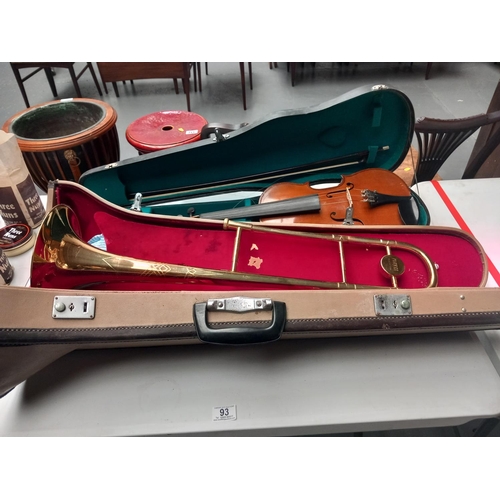 93 - A Parrot brass trombone in case together with a violin in case