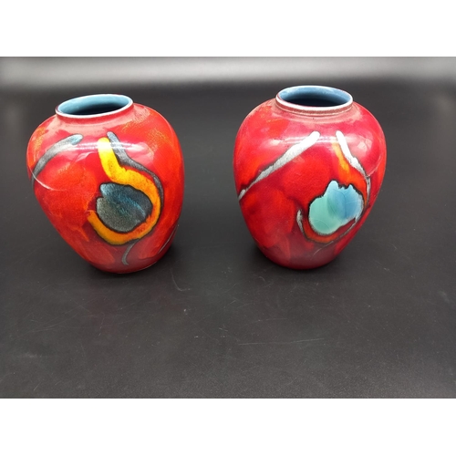 203 - Two Poole Pottery vases (6 inches tall)