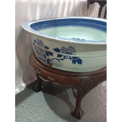 101 - A chinese 18th/19th century large blue and white washbowl on wooden stand 26 inches in diameter and ... 