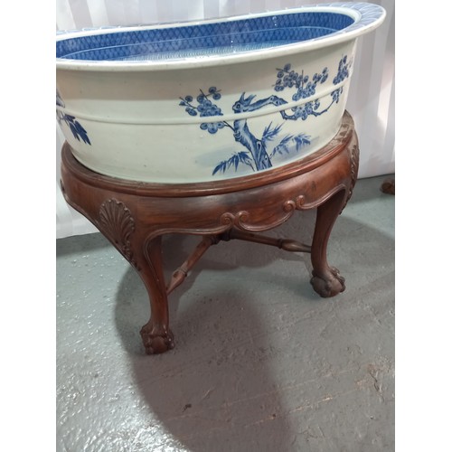 101 - A chinese 18th/19th century large blue and white washbowl on wooden stand 26 inches in diameter and ... 