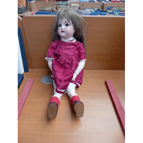 226 - An antique German doll - bisque head and composite body - Kammer and Rieinhardt and 
 Simon and Halb... 