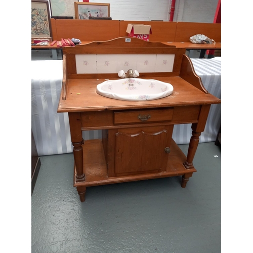 305 - A Victorian tiled back pine wash stand with original basin and tap Measurements 96cm length by 103cm... 