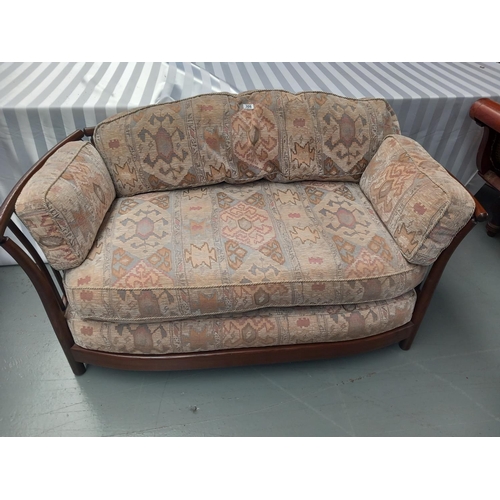 306 - An Ercol two seater sofa