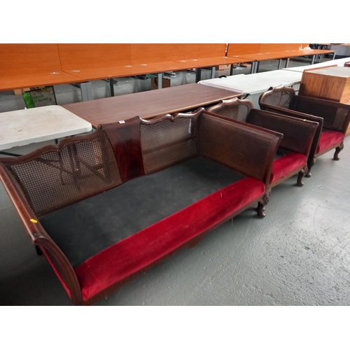 308 - A mahogany framed cane backed burgere suite consisting of a two seater sofa and two armchairs