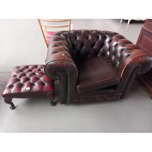 315 - A brown leather chesterfield club chair together with red leather chesterfield stool