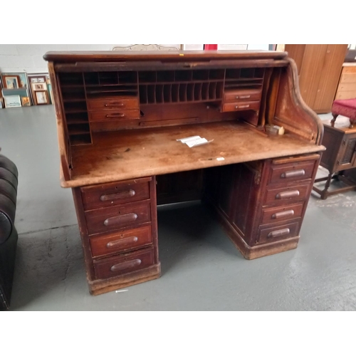 316 - A twin pedestal oak roll top desk