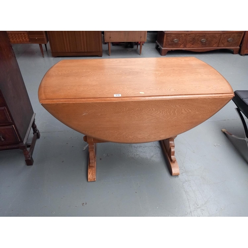 318 - An ercol drop leaf dining table