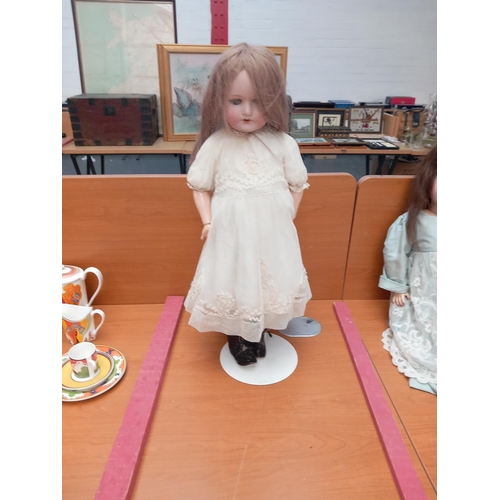 230 - An antique German doll (bisque head) by M Bergmann Waltershausen marks c1916 on stand - standing 26 ... 